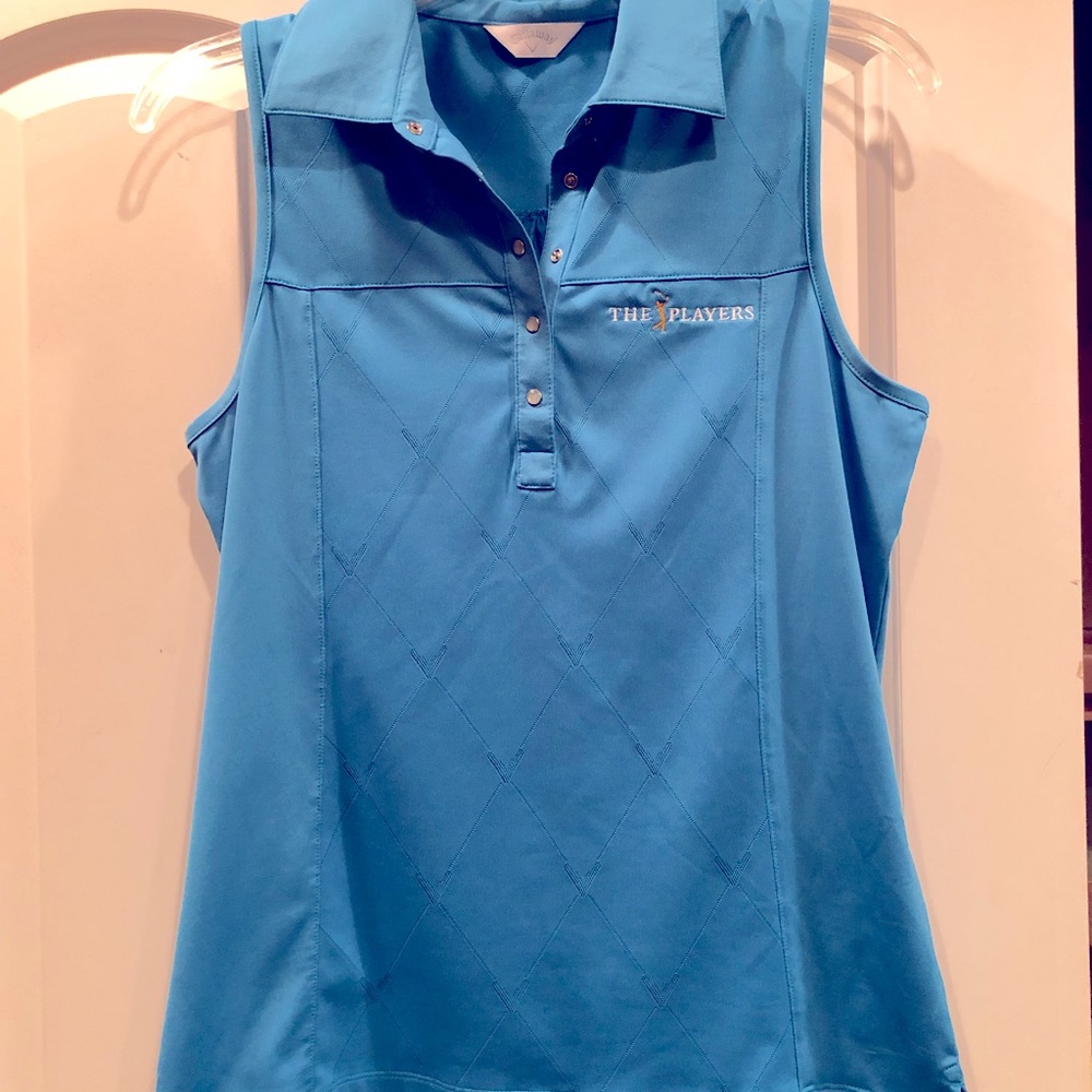 Brand new Callaway sleeveless blue golf shirt.